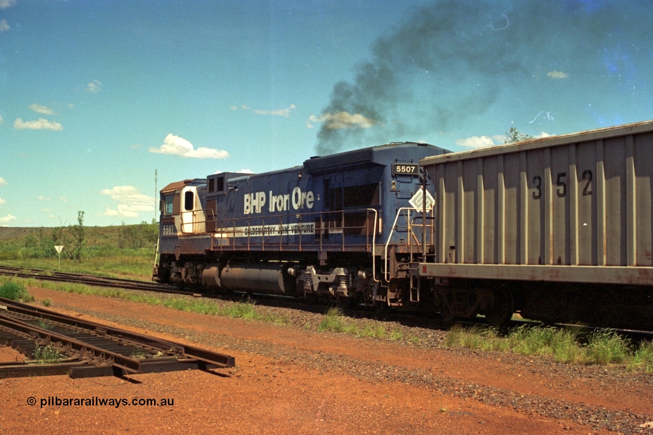 219-37
Goldsworthy Siding, C36-7M unit 5507 'Nimingarra' serial 4839-03 / 87-072, an original Mt Newman Mining ALCo C636 5461 to GE C36-7M rebuild carried out by Goninan, leads an empty train away from Goldsworthy, the waggon behind 5507 is numbered 352 and is one of ten Portec USA built waggons originally from Phelps Dodge Copper Mine.
Keywords: 5507;Goninan;GE;C36-7M;4839-03/87-072;rebuild;AE-Goodwin;ALCo;C636;5461;G6035-2;