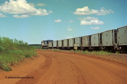 219-31
Goldsworthy Siding, C36-7M unit 5507 'Nimingarra' serial 4839-03 / 87-072, an original Mt Newman Mining ALCo C636 5461 to GE C36-7M rebuild carried out by Goninan, leads an empty train along the siding with ore waggons from both Gunderson USA (smooth) and Portec USA (ribbed) all ex-Phelps Dodge Copper Mine.
Keywords: 5507;Goninan;GE;C36-7M;4839-03/87-072;rebuild;AE-Goodwin;ALCo;C636;5461;G6035-2;