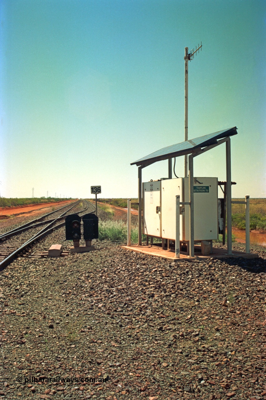 220-02
Taplin Siding, located between the 135 and 137.5 km on the former Goldsworthy Mining Ltd line, now part of the BHP Iron Ore network looking east past the point indicators and the 136 km post.
