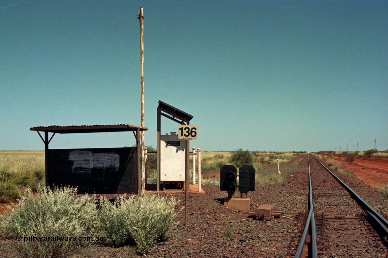 220-03
Taplin Siding, located between the 135 and 137.5 km on the former Goldsworthy Mining Ltd line, now part of the BHP Iron Ore network looking west at the points, indicator and shelter located at the 136 km or Hedland end.
