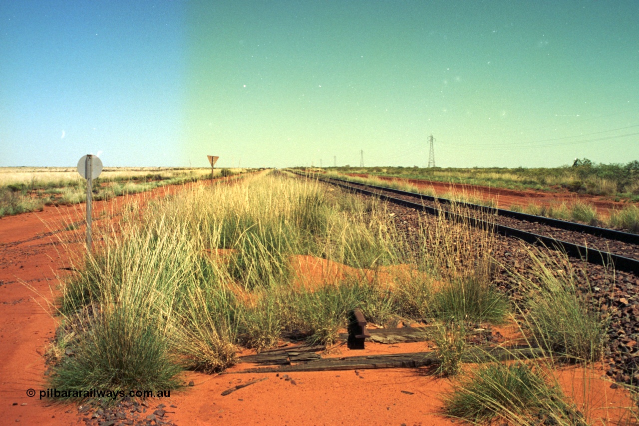 220-04
Taplin Siding, located between the 135 and 137.5 km on the former Goldsworthy Mining Ltd line, now part of the BHP Iron Ore network looking west from the eastern end of the siding.
