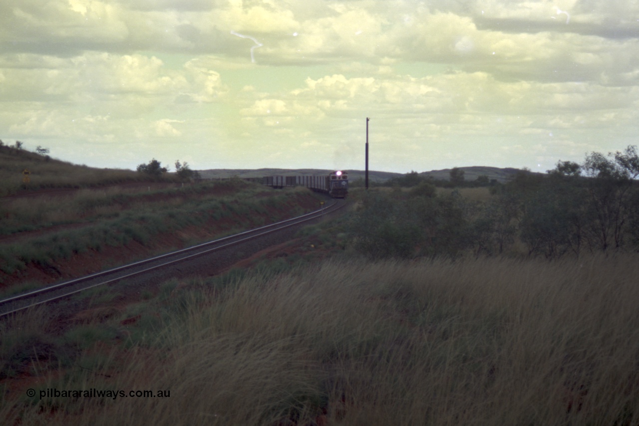 220-13
Just west of the 104.6 km crossing on the Yarrie line, BHP Iron Ore Goninan rebuilt ALCo C636 5431 into a C36-7M unit 5507 serial number 4839-03 / 87-072 seen here leading its loaded train through the curves.
Keywords: 5507;Goninan;GE;C36-7M;4839-03/87-072;rebuild;AE-Goodwin;ALCo;C636;5461;G6035-2;