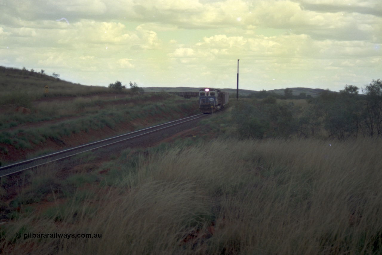 220-14
Just west of the 104.6 km crossing on the Yarrie line, BHP Iron Ore Goninan rebuilt ALCo C636 5431 into a C36-7M unit 5507 serial number 4839-03 / 87-072 seen here leading its loaded train through the curves.
Keywords: 5507;Goninan;GE;C36-7M;4839-03/87-072;rebuild;AE-Goodwin;ALCo;C636;5461;G6035-2;