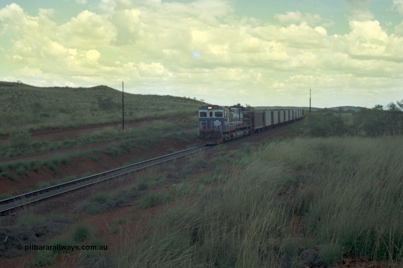 220-15
Just west of the 104.6 km crossing on the Yarrie line, BHP Iron Ore Goninan rebuilt ALCo C636 5431 into a C36-7M unit 5507 serial number 4839-03 / 87-072 seen here leading its loaded train through the curves.
Keywords: 5507;Goninan;GE;C36-7M;4839-03/87-072;rebuild;AE-Goodwin;ALCo;C636;5461;G6035-2;