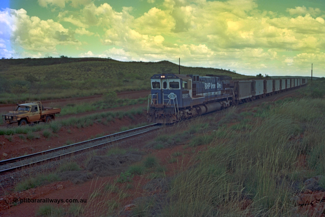 220-16
Just west of the 104.6 km crossing on the Yarrie line, BHP Iron Ore Goninan rebuilt ALCo C636 5431 into a C36-7M unit 5507 serial number 4839-03 / 87-072 seen here leading its loaded train through the curves.
Keywords: 5507;Goninan;GE;C36-7M;4839-03/87-072;rebuild;AE-Goodwin;ALCo;C636;5461;G6035-2;