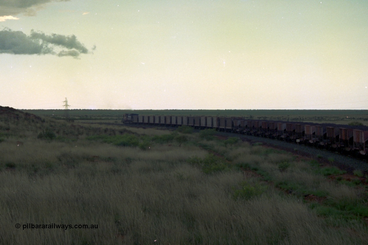 220-18
Just west of the 104.6 km crossing on the Yarrie line, BHP Iron Ore Goninan rebuilt ALCo C636 5431 into a C36-7M unit 5507 serial number 4839-03 / 87-072 seen here leading its loaded train through the curves.
Keywords: 5507;Goninan;GE;C36-7M;4839-03/87-072;rebuild;AE-Goodwin;ALCo;C636;5461;G6035-2;