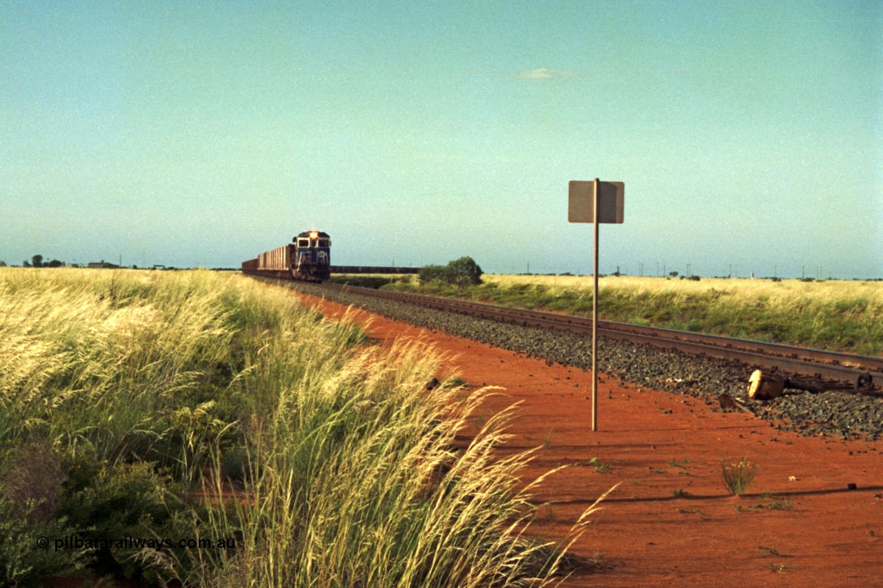 220-21
Goldsworthy Junction, a loaded train from Yarrie mine lead by BHP Dash 7 unit 5507 'Nimingarra' serial 4839-03 / 87-072 was rebuilt by Goninan WA from an ALCo C636 unit 5461 into GE model C36-7M in 1987.
Keywords: 5507;Goninan;GE;C36-7M;4839-03/87-072;rebuild;AE-Goodwin;ALCo;C636;5461;G6035-2;