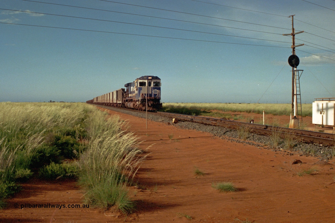 220-23
Goldsworthy Junction, a loaded train from Yarrie mine lead by BHP Dash 7 unit 5507 'Nimingarra' serial 4839-03 / 87-072 was rebuilt by Goninan WA from an ALCo C636 unit 5461 into GE model C36-7M in 1987.
Keywords: 5507;Goninan;GE;C36-7M;4839-03/87-072;rebuild;AE-Goodwin;ALCo;C636;5461;G6035-2;