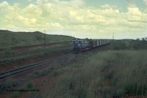 220-15
Just west of the 104.6 km crossing on the Yarrie line, BHP Iron Ore Goninan rebuilt ALCo C636 5431 into a C36-7M unit 5507 serial number 4839-03 / 87-072 seen here leading its loaded train through the curves.
Keywords: 5507;Goninan;GE;C36-7M;4839-03/87-072;rebuild;AE-Goodwin;ALCo;C636;5461;G6035-2;