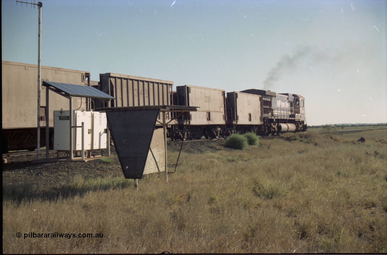 221-10
Hardie Siding, with the days of C36-7M operations numbered, Goninan rebuild 5513 serial 88-078 / 4839-02 from ALCo C636 5453 heads away from Hardie past the location equipment and the train crew shelter with a loaded train bound for Finucane Island.
Keywords: 5513;Goninan;GE;C36-7M;4839-02/88-078;rebuild;AE-Goodwin;ALCo;C636;5453;G6012-2;