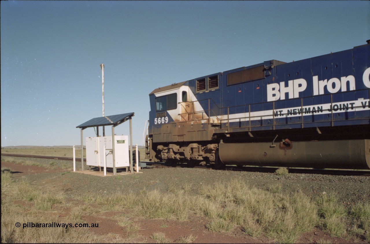 221-16
Hardie Siding, BHP Iron Ore Goninan rebuild unit CM40-8MEFI 5669 the last Dash 8 rebuilt for BHP and one of four fitted with an EFI prime mover, serial 95-160/8412-02, passes the Hardie Station 71 location cases and continues on the mainline bound for loading at Yarrie.
Keywords: 5669;Goninan;GE;CM40-8EFI;8412-02/95-160;rebuild;Comeng-NSW;ALCo;M636C;5486;C6084-2;