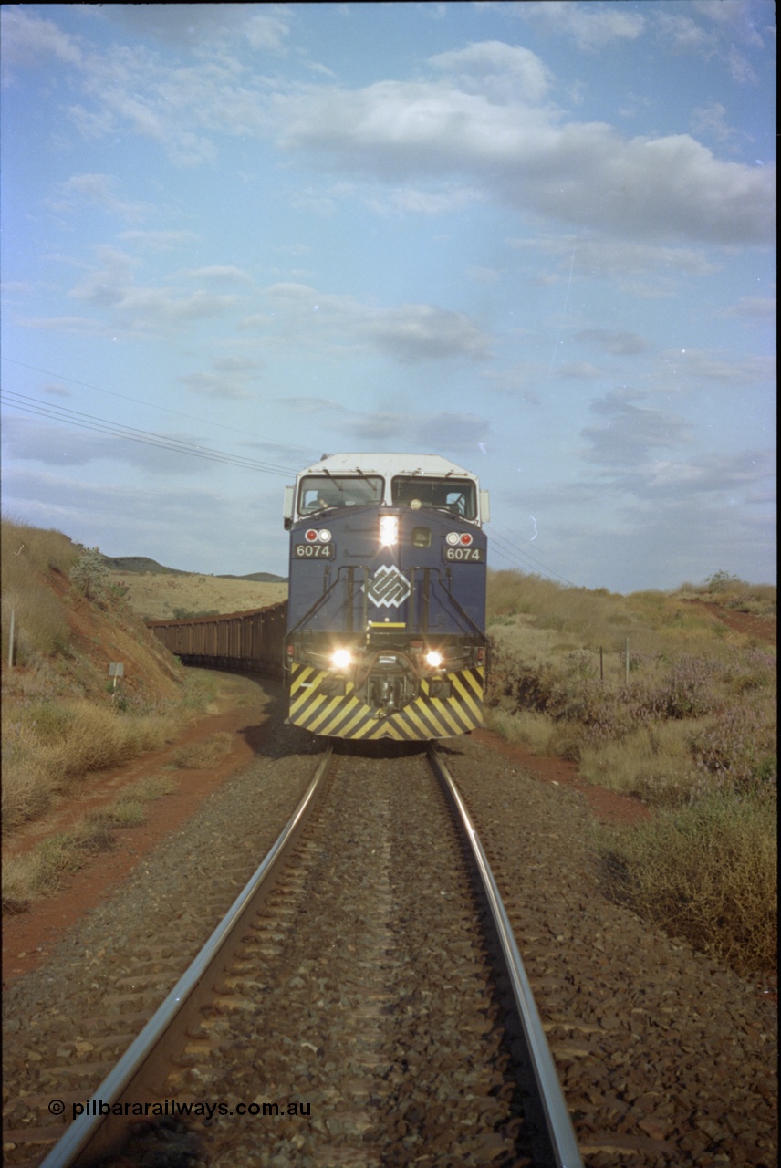 221-36
Yandi One mine loadout balloon loop, front on view of near new General Electric AC6000 unit 6074 serial 51066 as it loads a train.
Keywords: 6074;GE;AC6000;51066;