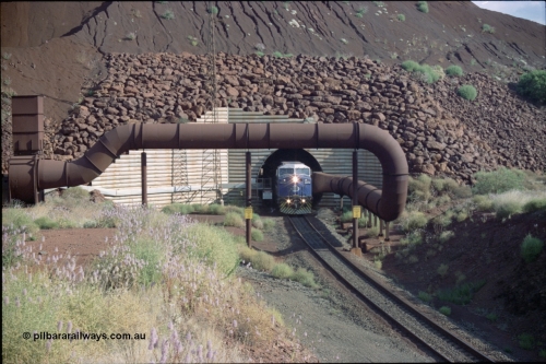 221-22
Yandi One mine loadout balloon loop, General Electric AC6000 class emerges from the loadout portal at 0.9 km/h as it leads a train through the loading vaults, the dust extraction ducting is also visible.
Keywords: GE;AC6000CW;