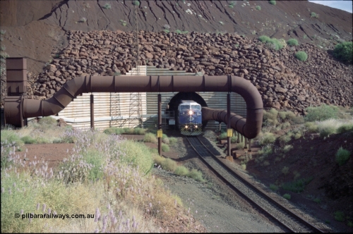 221-23
Yandi One mine loadout balloon loop, General Electric AC6000 class emerges from the loadout portal at 0.9 km/h as it leads a train through the loading vaults, the dust extraction ducting is also visible.
Keywords: GE;AC6000CW;
