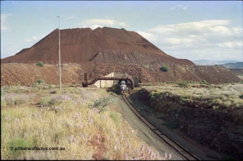 221-24
Yandi One mine loadout balloon loop, overview of the stockpile, the train can be seen in the middle distance on the right.
Keywords: GE;AC6000CW;