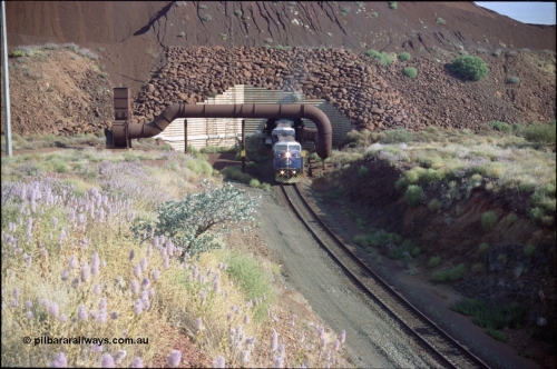 221-25
Yandi One mine loadout balloon loop, General Electric AC6000 class emerges from the loadout portal at 0.9 km/h as it leads a train through the loading vaults, the dust extraction ducting is also visible.
Keywords: GE;AC6000CW;