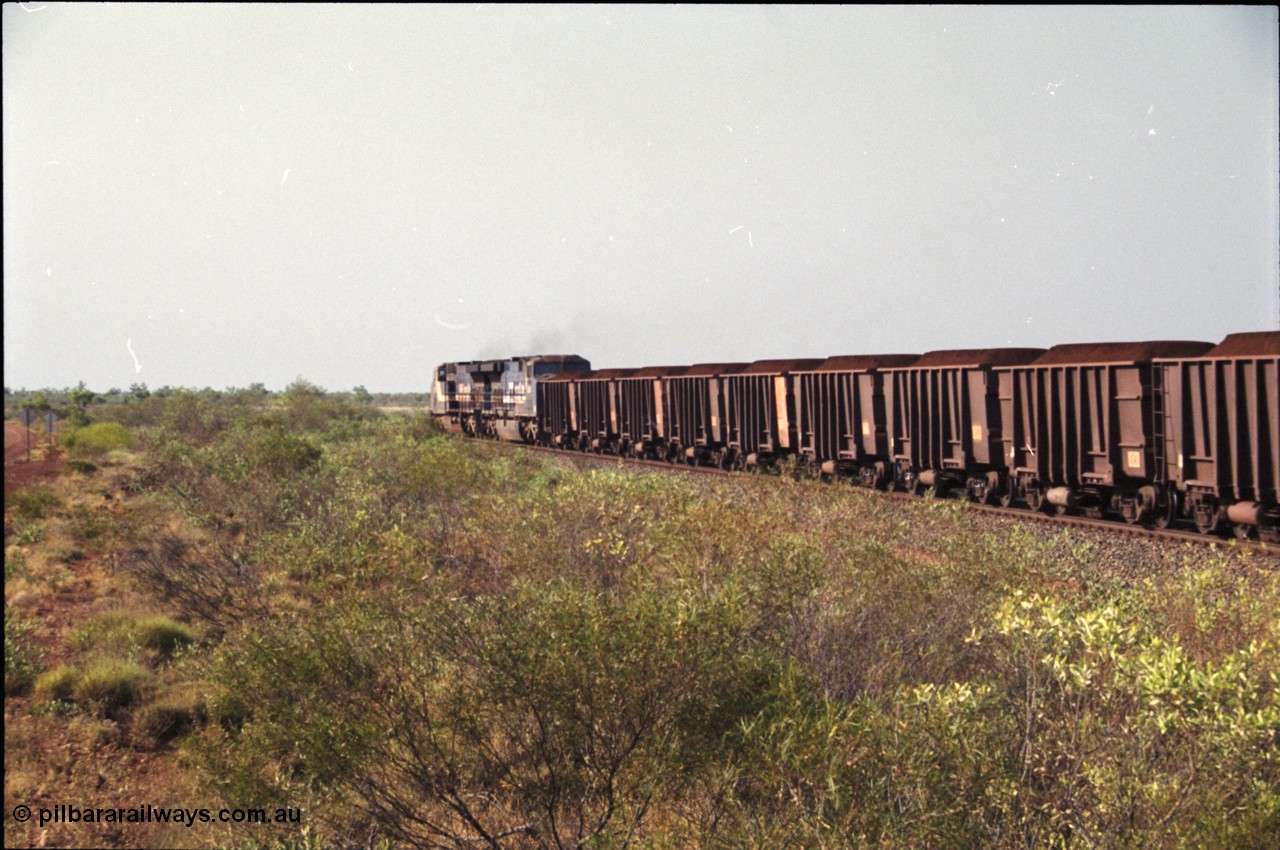 222-04
At the 105.7 km grade crossing near Gillam Siding, a loaded Yandi train departing behind two General Electric AC6000 units built by GE at their Erie plant. Gillam Siding is at the 97.1 km. [url=https://goo.gl/maps/7emwhQdnBN32]GeoData[/url].
