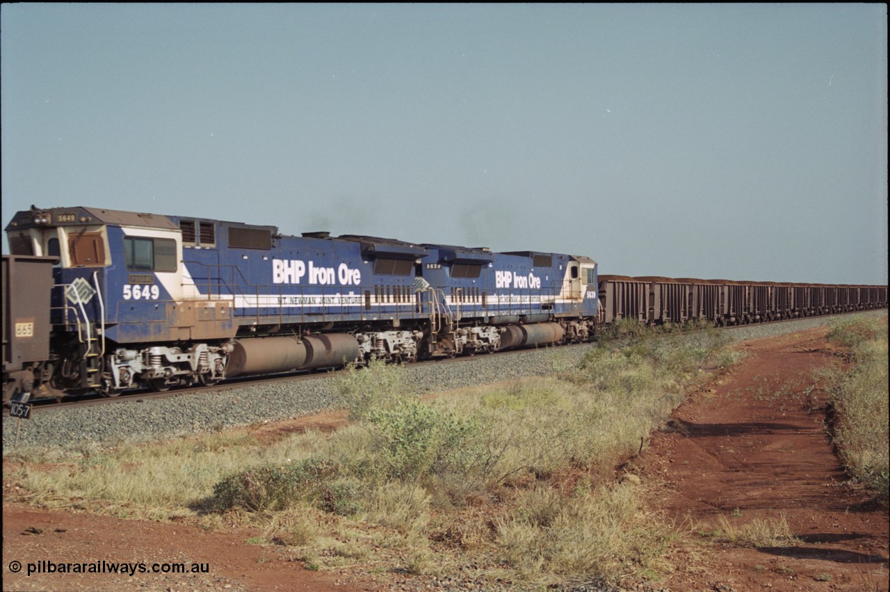 222-05
At the 105.7 km grade crossing near Gillam Siding, a loaded Yandi train's remote units 5649 'Pohang' serial 8412-07 / 93-140 and sister unit 5639 both Goninan rebuild CM40-8M GE units. This road was also the original road into Lynas Find Gold Project, back in the day. [url=https://goo.gl/maps/7emwhQdnBN32]GeoData[/url].
Keywords: 5649;Goninan;GE;CM40-8M;8412-07/93-140;rebuild;AE-Goodwin;ALCo;M636C;5473;G6047-5;