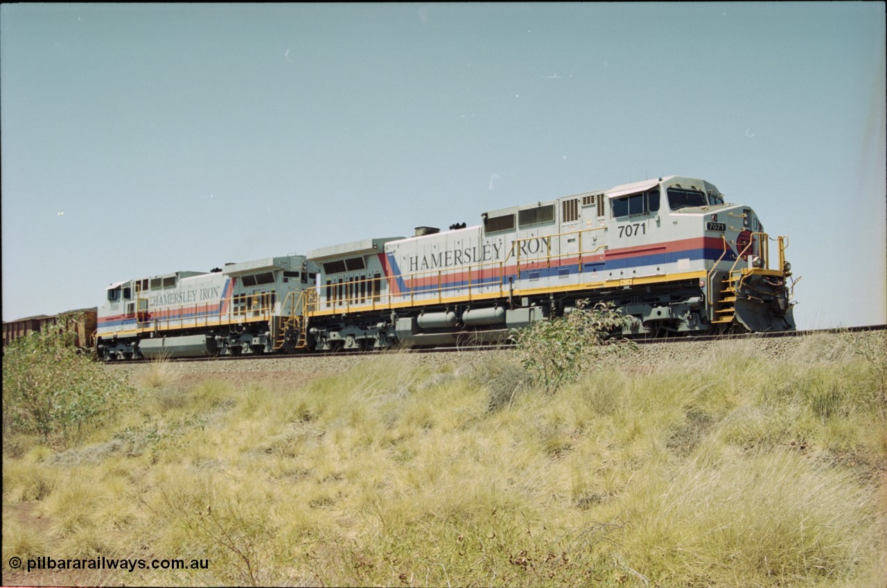 222-17
Somewhere on the original single line section between Gull and Rosella Hamersley Iron 7071 serial 47750 a General Electric Dash 9-44CW built by GE at Erie brings a loaded train to a stand with 7066 for a crew change.
Keywords: 7071;GE;Dash-9-44CW;47750;