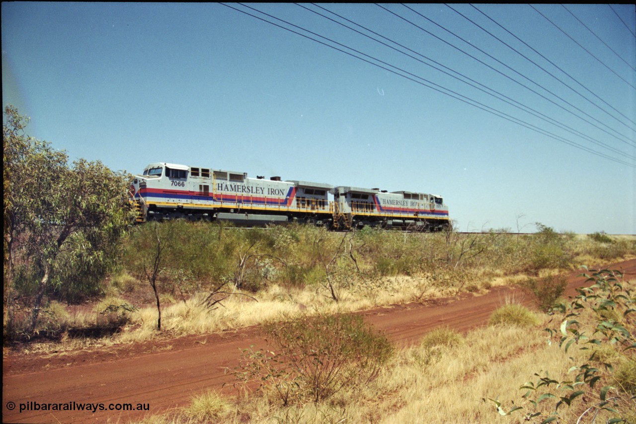 222-18
Somewhere on the original single line section between Gull and Rosella Hamersley Iron 7066 serial 47745 a General Electric Dash 9-44CW built by GE at Erie brings a loaded train to a stand with 7071 for a crew change.
Keywords: 7066;GE;Dash-9-44CW;47745;