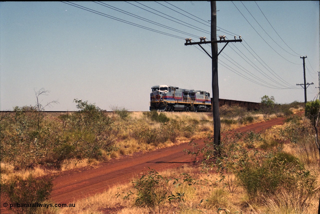 222-21
Somewhere on the original single line section between Gull and Rosella Hamersley Iron 7073 serial 47752 a General Electric Dash 9-44CW built by GE at Erie brings an empty train to a stop with 7091 for a crew change.
Keywords: 7073;GE;Dash-9-44CW;47752;