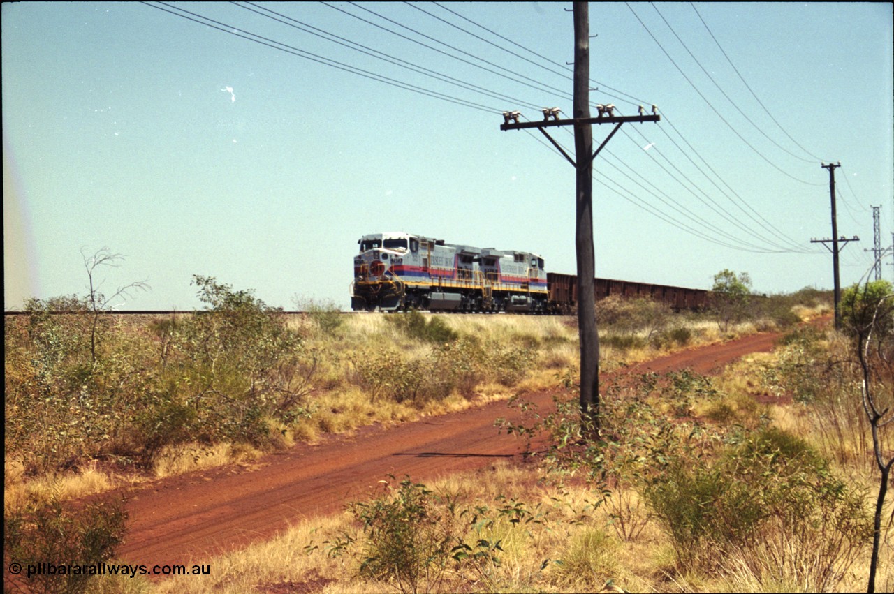 222-22
Somewhere on the original single line section between Gull and Rosella Hamersley Iron 7073 serial 47752 a General Electric Dash 9-44CW built by GE at Erie brings an empty train to a stop with 7091 for a crew change.
Keywords: 7073;GE;Dash-9-44CW;47752;