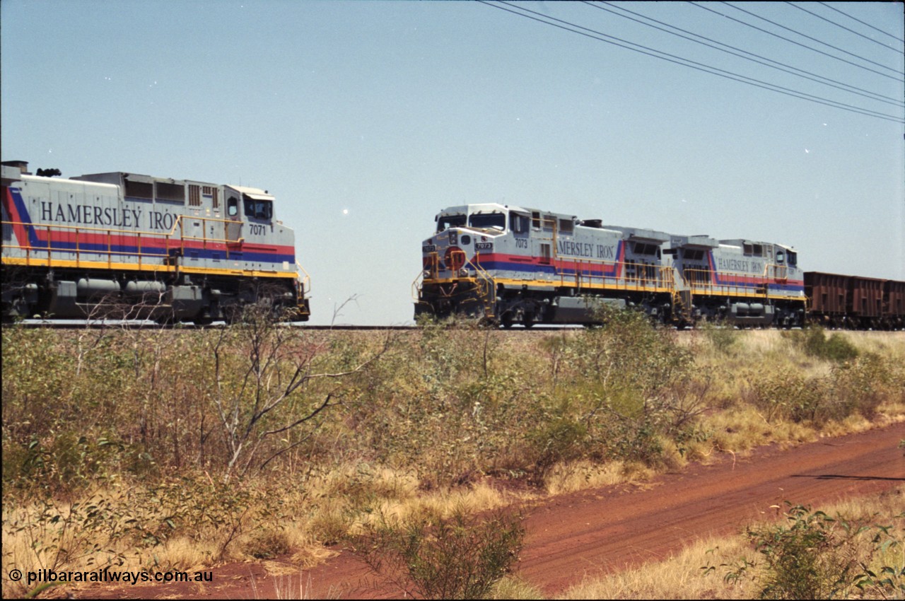 222-23
Somewhere on the original single line section between Gull and Rosella Hamersley Iron 7073 serial 47752 a General Electric Dash 9-44CW built by GE at Erie brings an empty train to a stop with 7091 for a crew change besides a loaded headed up by 7071.
Keywords: 7073;GE;Dash-9-44CW;47752;