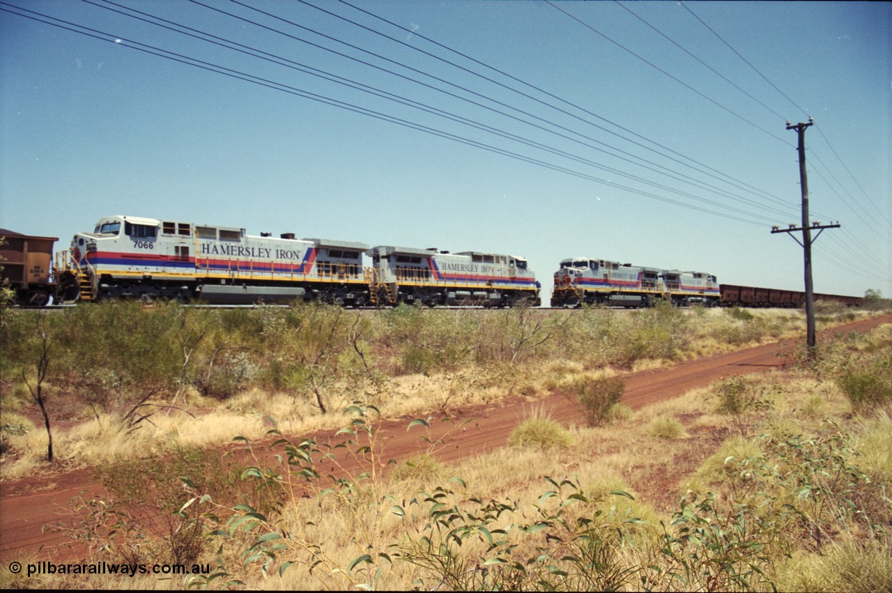 222-24
Somewhere on the original single line section between Gull and Rosella Hamersley Iron 7073 serial 47752 a General Electric Dash 9-44CW built by GE at Erie brings an empty train to a stop with 7091 for a crew change besides a loaded headed up by 7071.
Keywords: 7066;GE;Dash-9-44CW;47745;