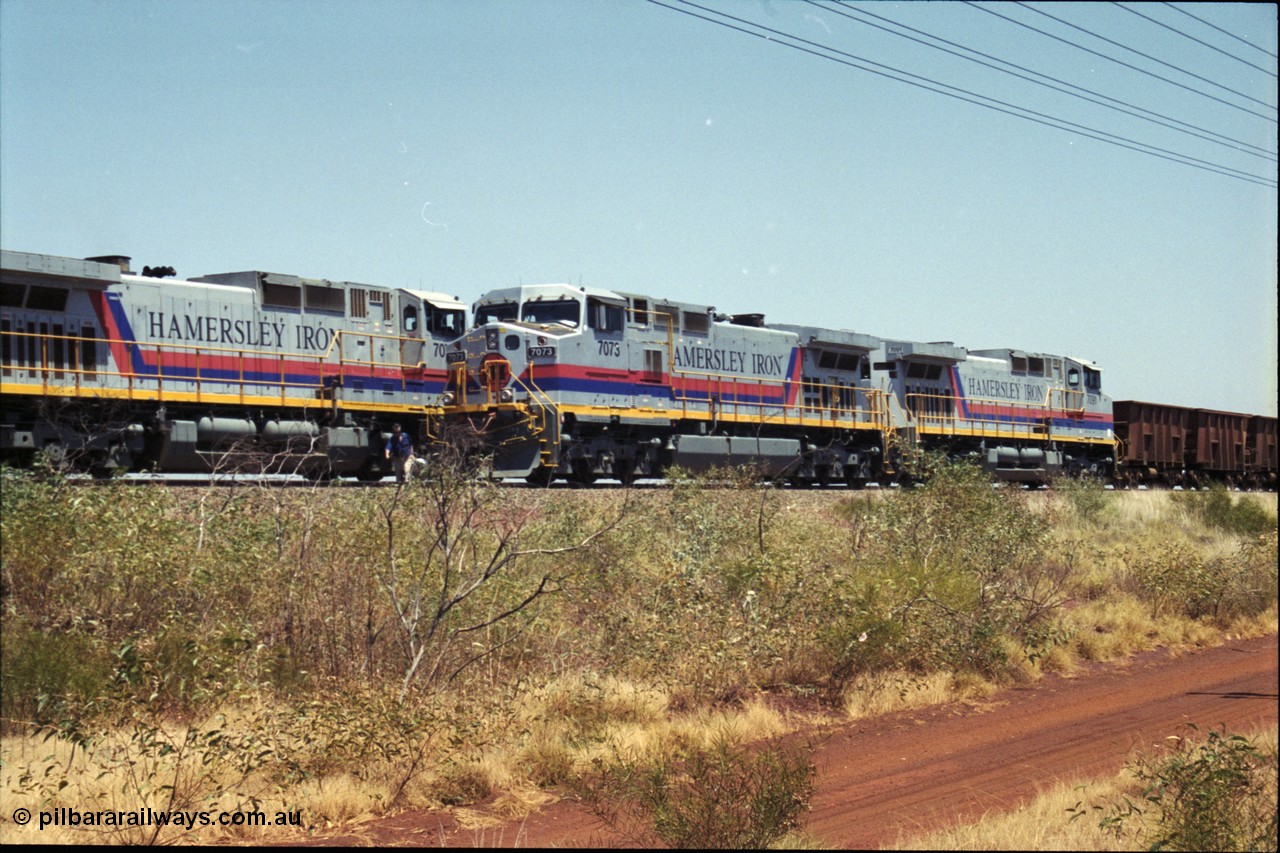 222-25
Somewhere on the original single line section between Gull and Rosella Hamersley Iron 7073 serial 47752 a General Electric Dash 9-44CW built by GE at Erie with 7091 has stopped for a crew change besides a loaded headed up by 7071.
Keywords: 7073;GE;Dash-9-44CW;47752;