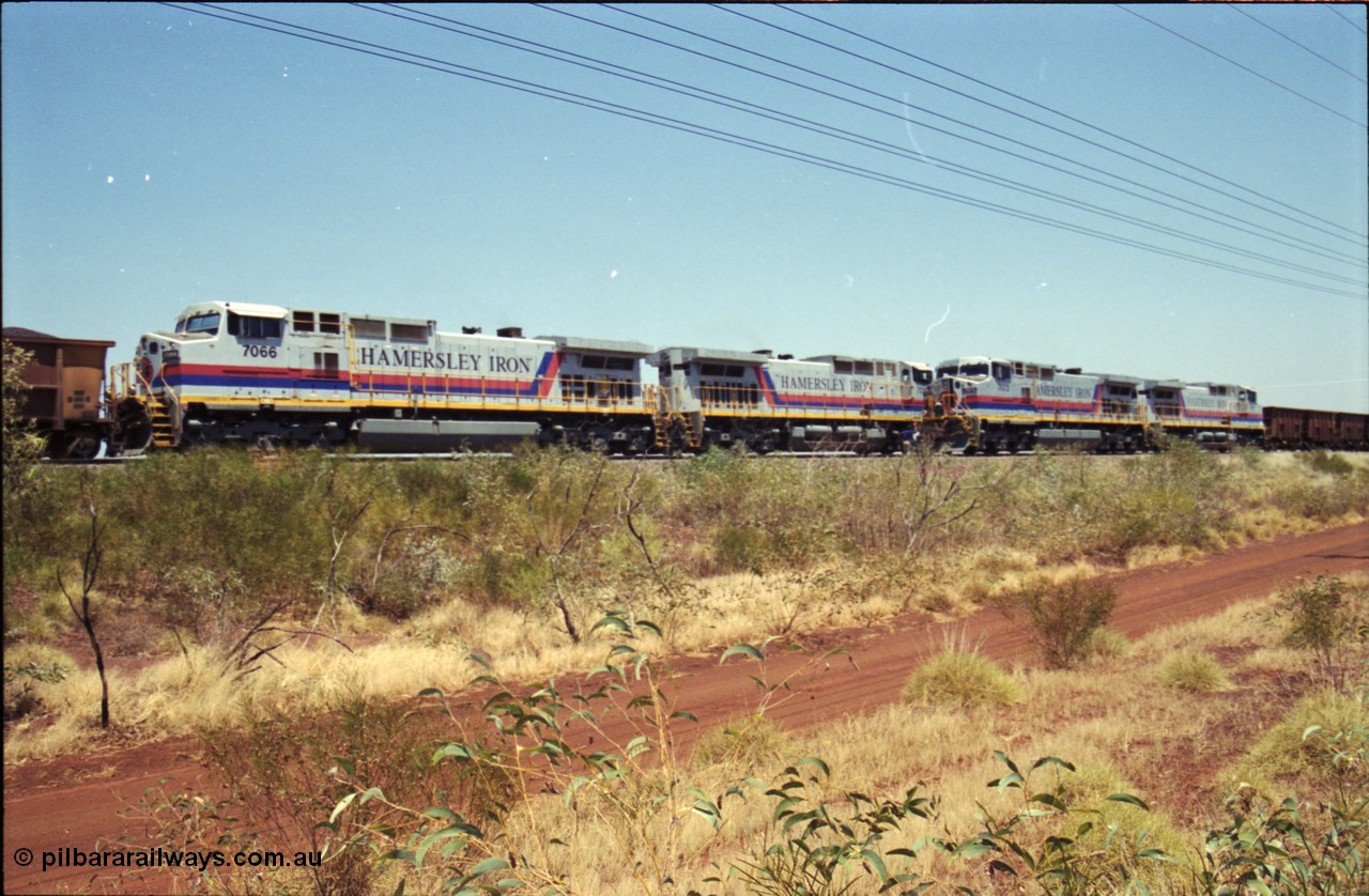 222-27
Somewhere on the original single line section between Gull and Rosella Hamersley Iron 7073 serial 47752 a General Electric Dash 9-44CW built by GE at Erie with 7091 has stopped for a crew change besides a loaded headed up by 7071.
Keywords: 7073;GE;Dash-9-44CW;47752;