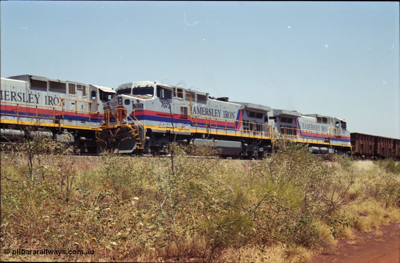 222-28
Somewhere on the original single line section between Gull and Rosella Hamersley Iron 7073 serial 47752 a General Electric Dash 9-44CW built by GE at Erie with 7091 has stopped for a crew change besides a loaded headed up by 7071.
Keywords: 7066;GE;Dash-9-44CW;47745;