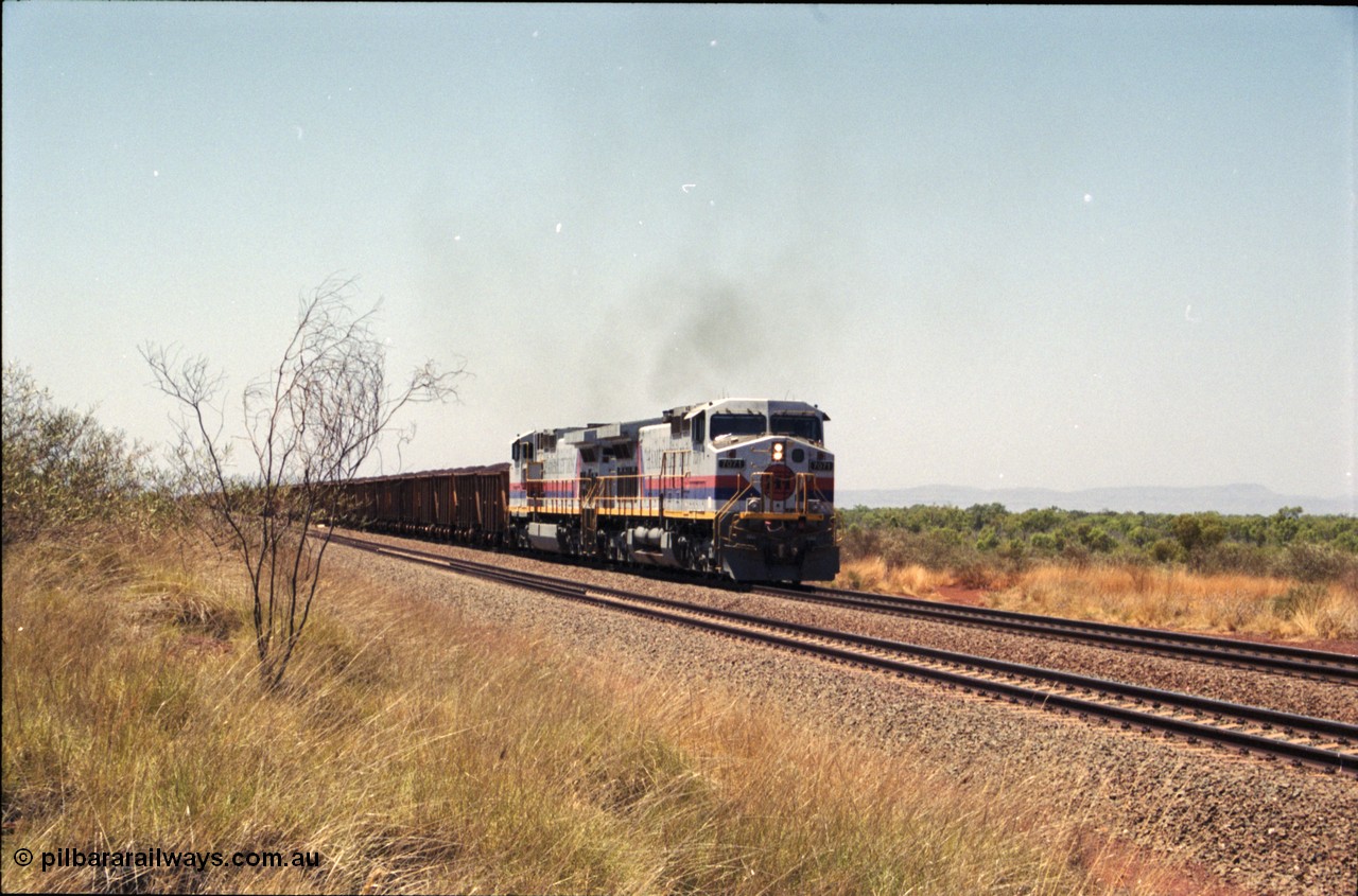 222-31
Somewhere on the original single line section between Gull and Rosella Hamersley Iron 7071 serial 47750 a General Electric Dash 9-44CW built by GE at Erie brings a loaded train away from the passing track back onto the mainline following a crew change with second unit 7066.
Keywords: 7071;GE;Dash-9-44CW;47750;