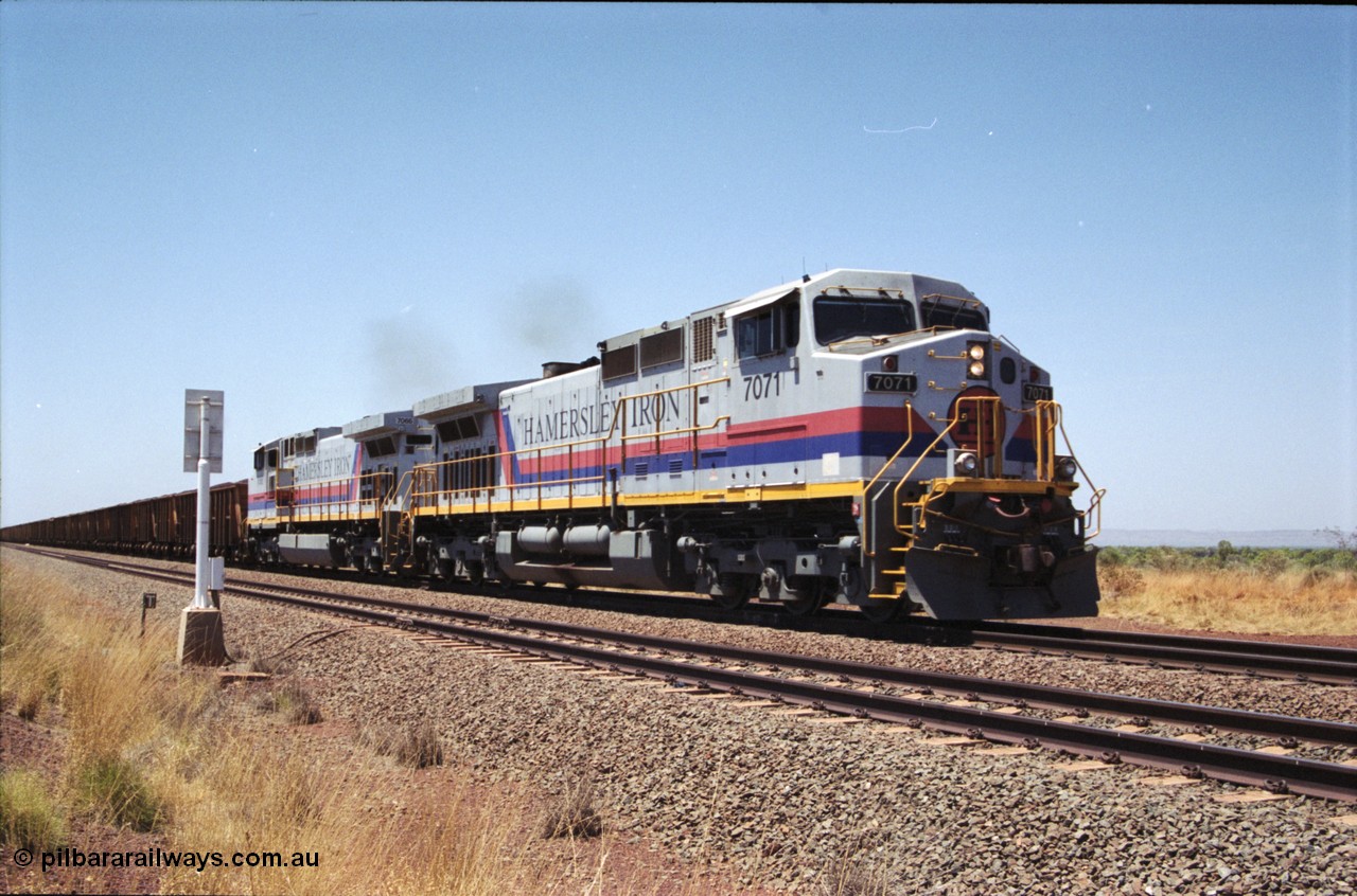 222-32
Somewhere on the original single line section between Gull and Rosella Hamersley Iron 7071 serial 47750 a General Electric Dash 9-44CW built by GE at Erie brings a loaded train away from the passing track back onto the mainline following a crew change with second unit 7066.
Keywords: 7071;GE;Dash-9-44CW;47750;