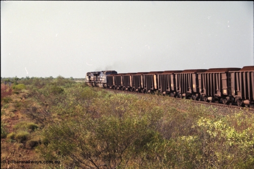 222-04
At the 105.7 km grade crossing near Gillam Siding, a loaded Yandi train departing behind two General Electric AC6000 units built by GE at their Erie plant. Gillam Siding is at the 97.1 km. [url=https://goo.gl/maps/7emwhQdnBN32]GeoData[/url].
