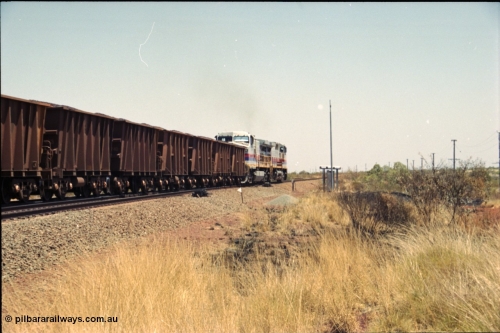 222-35
Somewhere on the original single line section between Gull and Rosella a pair of Hamersley Iron General Electric Dash 9-44CW's built by GE at Erie power a loaded train towards Dampier from the passing track back onto the mainline following a crew change.

