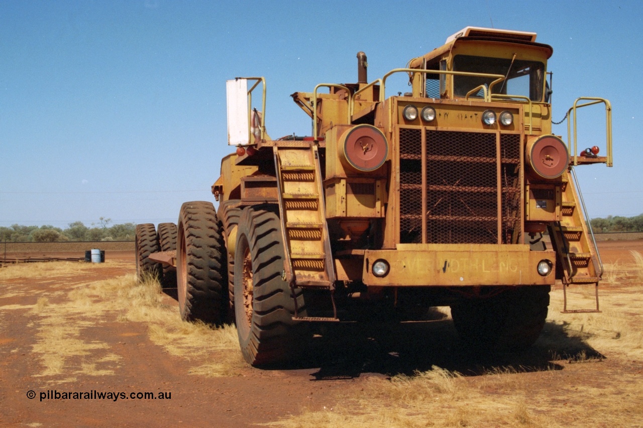 223-04
Rosella Siding, old Hamersley Iron machine transporter, prime mover is a KW Dart, possibly a model DE 2551. 21st October 2000.
Keywords: KW-Dart;DE2551;