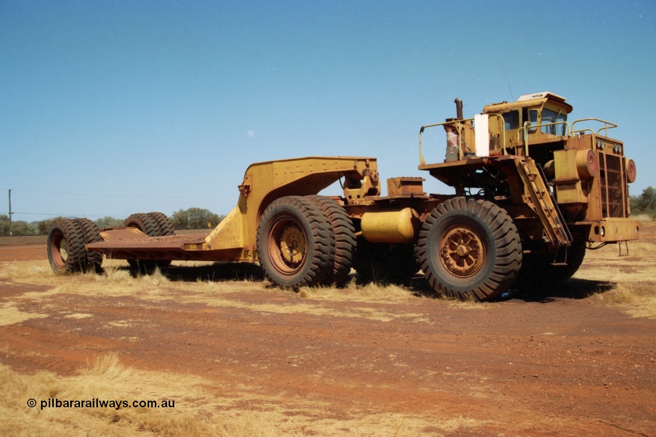 223-06
Rosella Siding, old Hamersley Iron machine transporter, prime mover is a KW Dart, possibly a model DE 2551. 21st October 2000.
Keywords: KW-Dart;DE2551;