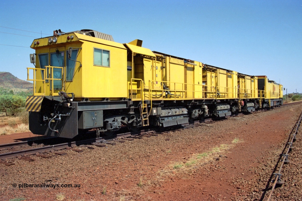 223-07
Possum Siding, Hamersley Iron rail grinder, Speno built RR 48 M-1 model sits in the back track siding. 21st October 2000.
Keywords: Speno;RR48;M1;rail-grinder;