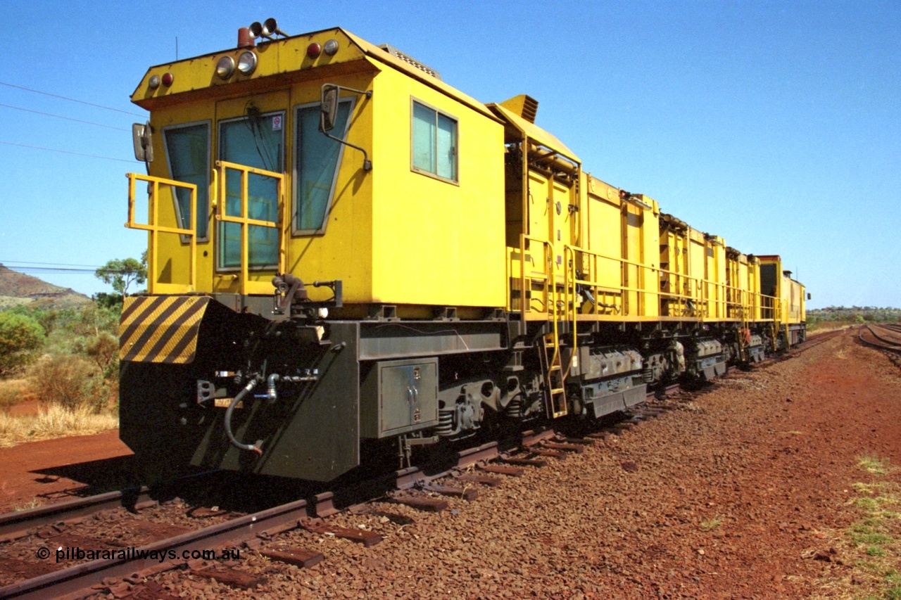 223-10
Possum Siding, Hamersley Iron rail grinder, Speno built RR 48 M-1 model sits in the back track siding. 21st October 2000.
Keywords: Speno;RR48;M1;rail-grinder;