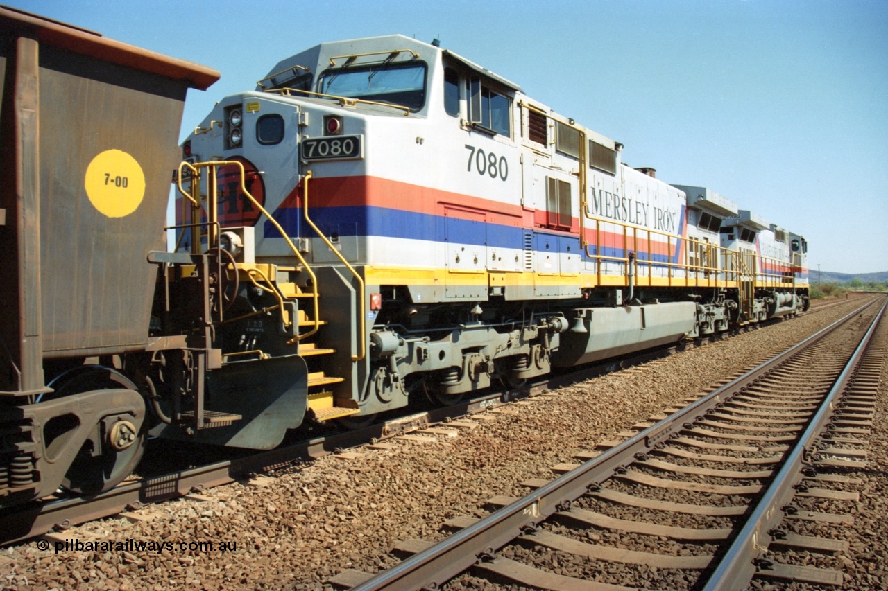 223-16
Possum Siding, trailing view of Hamersley Iron loco 7080 a General Electric built Dash 9-44CW serial 47759 second unit behind sister locomotive 7082 looking south. 21st October 2000.
Keywords: 7080;GE;Dash-9-44CW;47759;