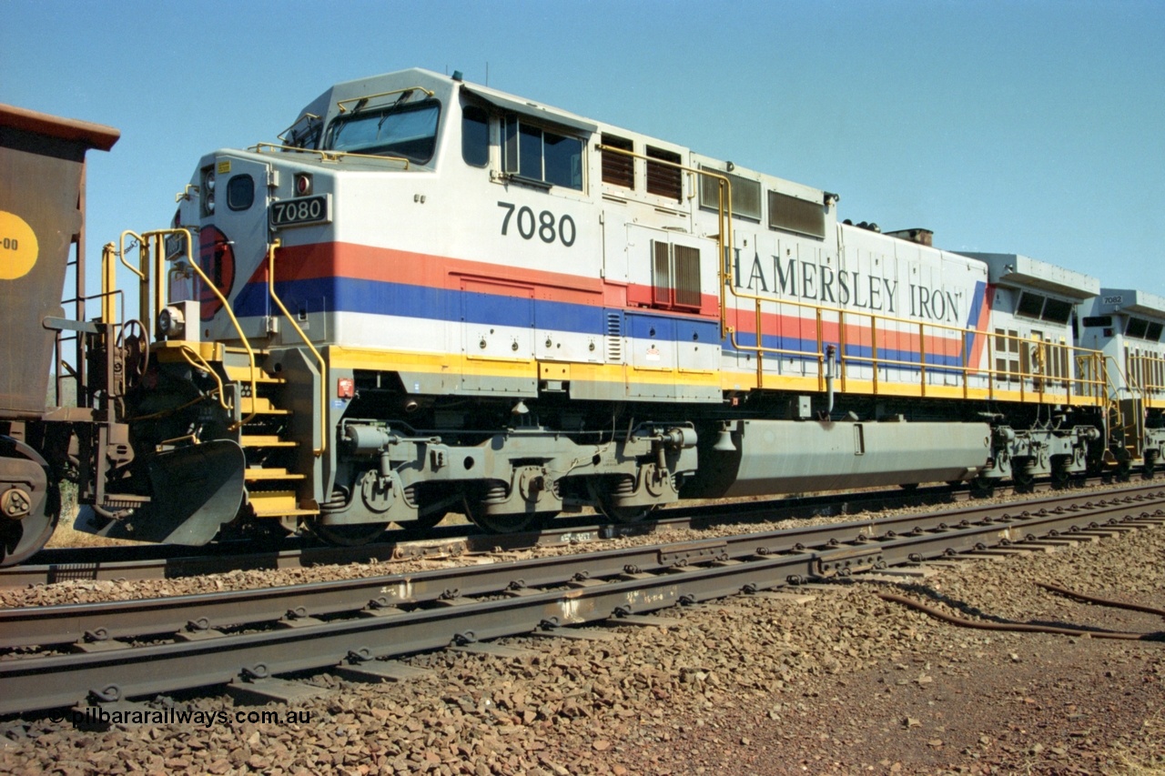 223-17
Possum Siding, trailing view of Hamersley Iron loco 7080 a General Electric built Dash 9-44CW serial 47759 second unit behind sister locomotive 7082 looking south. 21st October 2000.
Keywords: 7080;GE;Dash-9-44CW;47759;