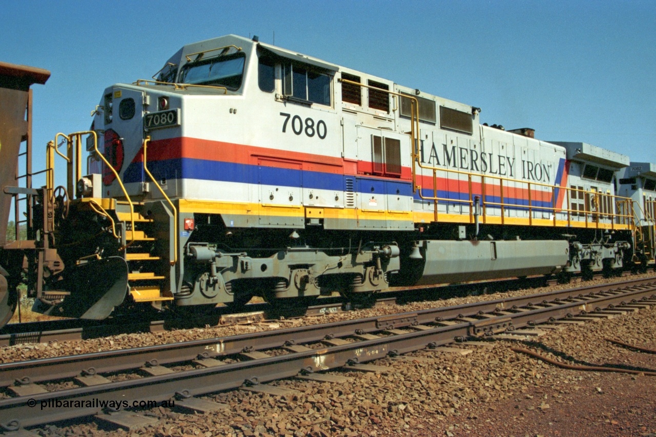 223-18
Possum Siding, trailing view of Hamersley Iron loco 7080 a General Electric built Dash 9-44CW serial 47759 second unit behind sister locomotive 7082 looking south. 21st October 2000.
Keywords: 7080;GE;Dash-9-44CW;47759;