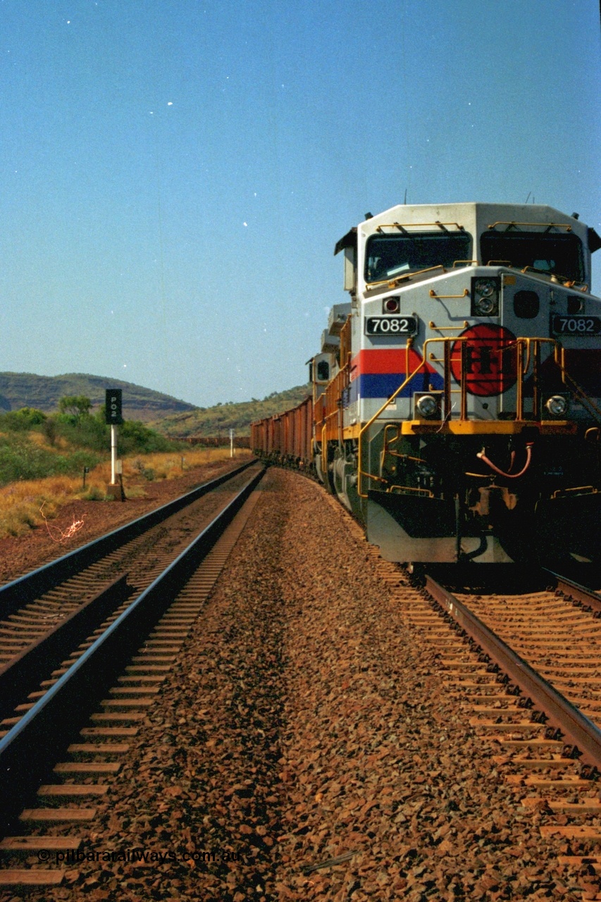 223-20
Possum Siding, Hamersley Iron loco 7082 a General Electric built Dash 9-44CW serial 47761 leads sister unit 7080 with an empty train just inside the loop waiting to effect a crew change. 21st October 2000.
Keywords: 7082;GE;Dash-9-44CW;47761;