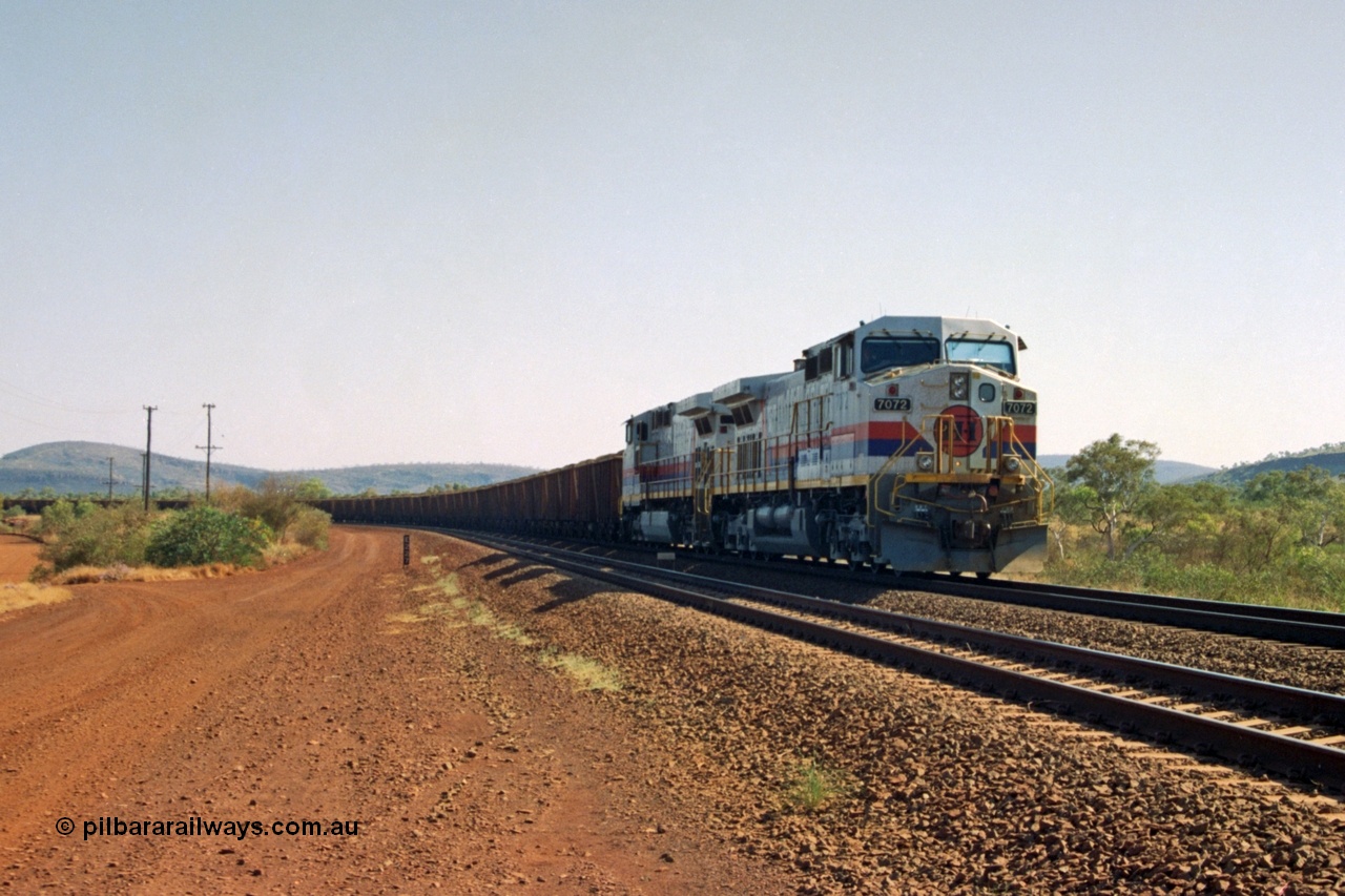 223-36
Possum Siding 227 km, a loaded train behind a pair of Hamersley Iron General Electric built Dash 9-44CW units 7072 serial 47751 and 7074 serial 47753 on a loaded train ex Marandoo holds the mainline awaiting clearance north. 21st October 2000.
Keywords: 7072;GE;Dash-9-44CW;47751;