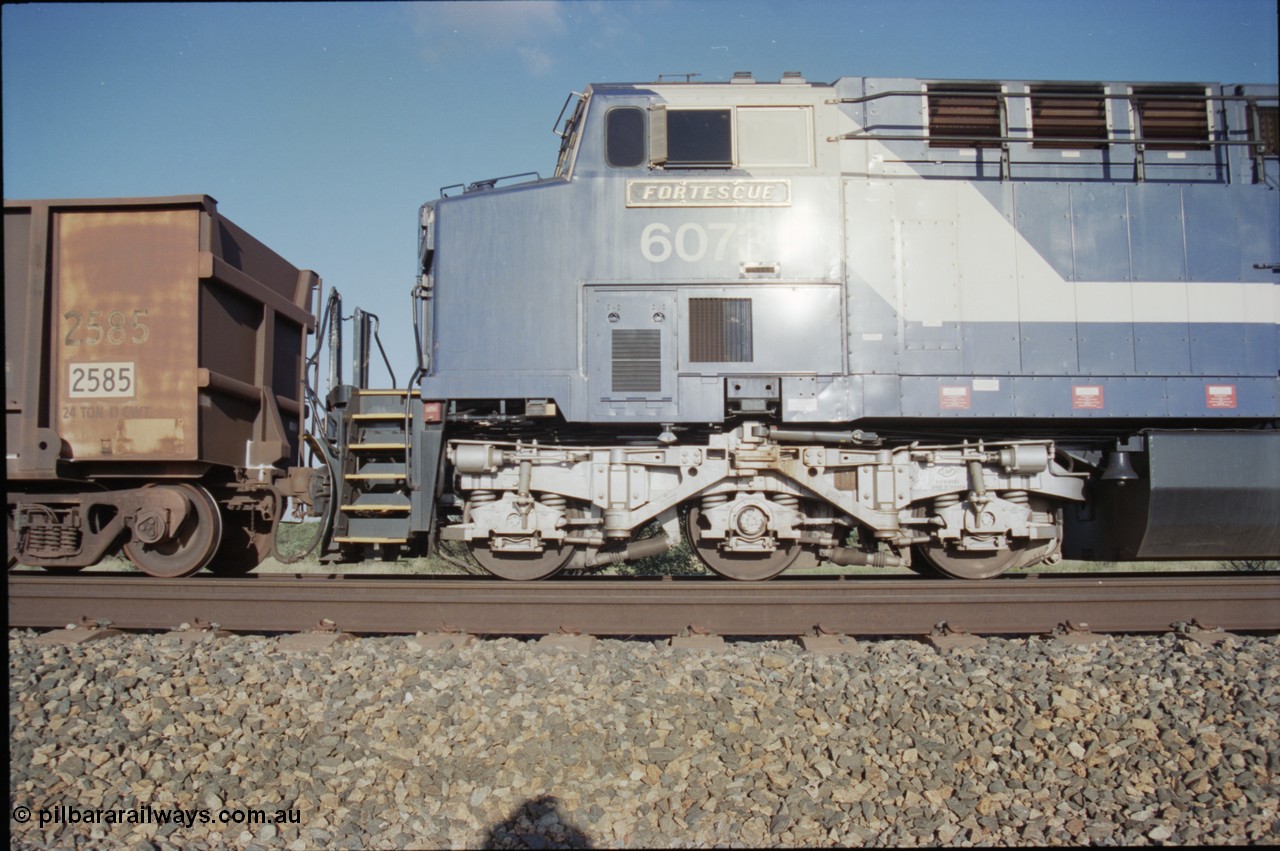 224-08
Bing siding, 6073 'Fortescue' serial 51065 a General Electric AC6000 built by GE at Erie awaits the road to depart south, cab side shows new nameplate, steerable bogie and taper in cab side. [url=https://goo.gl/maps/KQrczNpVhAH2]GeoData[/url].
Keywords: 6073;GE;AC6000;51065;