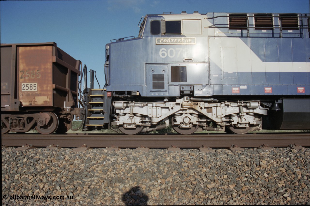 224-09
Bing siding, 6073 'Fortescue' serial 51065 a General Electric AC6000 built by GE at Erie awaits the road to depart south, cab side shows new nameplate, steerable bogie and taper in cab side. [url=https://goo.gl/maps/KQrczNpVhAH2]GeoData[/url].
Keywords: 6073;GE;AC6000;51065;