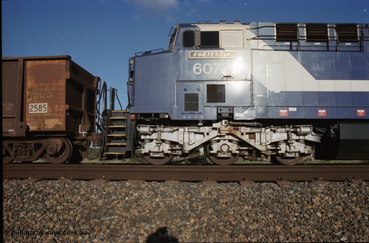 224-10
Bing siding, 6073 'Fortescue' serial 51065 a General Electric AC6000 built by GE at Erie awaits the road to depart south, cab side shows new nameplate, steerable bogie and taper in cab side. [url=https://goo.gl/maps/KQrczNpVhAH2]GeoData[/url].
Keywords: 6073;GE;AC6000;51065;
