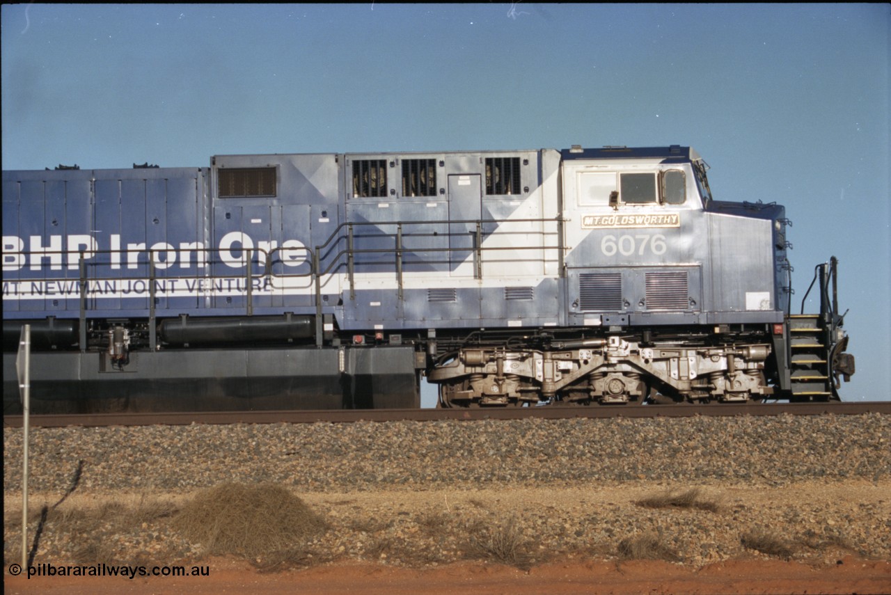 224-19
Bing siding, 6076 'Mt Goldsworthy' serial 51068 a General Electric AC6000 built by GE at Erie awaits the road to depart south, cab side shows new nameplate, steerable bogie and taper in cab side. [url=https://goo.gl/maps/KQrczNpVhAH2]GeoData[/url].
Keywords: 6076;GE;AC6000;51068;