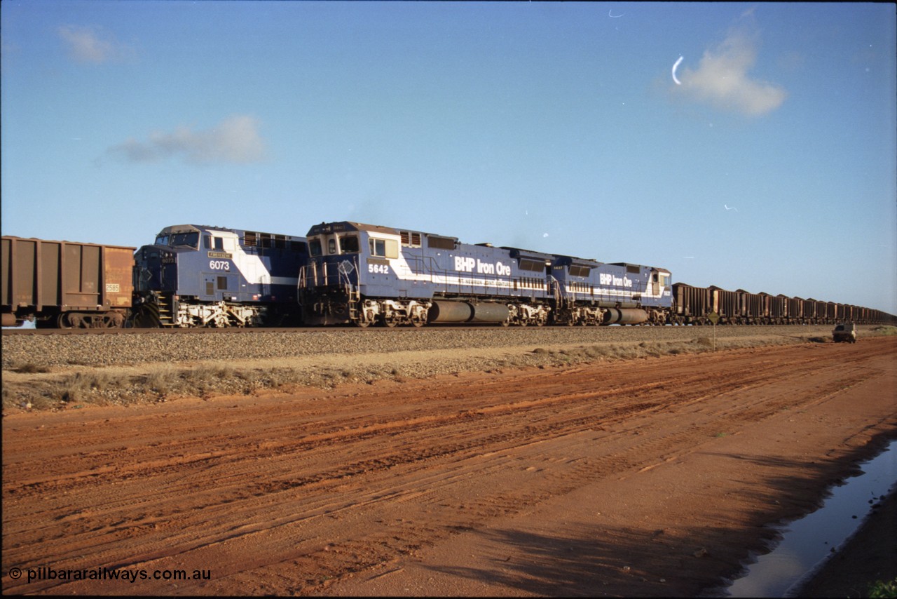 224-25
Bing siding, the afternoon empty to Yandi waits in the loop as a loaded behind two Goninan rebuilt CM40-8M GE units rolls through on the mainline, 5642 'Wallareenya' serial 8281-07 / 92-131 leads sister unit 5637. [url=https://goo.gl/maps/KQrczNpVhAH2]GeoData[/url].
Keywords: 5642;Goninan;GE;CM40-8M;8281-07/92-131;rebuild;AE-Goodwin;ALCo;C636;5467;G6041-3;