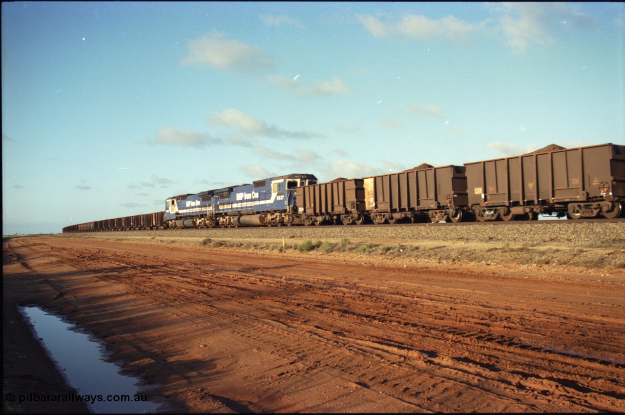 224-26
Bing siding, the afternoon empty to Yandi waits in the loop as a loaded behind two Goninan rebuilt CM40-8M GE units rolls through on the mainline, 5637 'De Grey' serial 8181-01 / 92-123 trails sister unit 5642 'Wallareenya'. [url=https://goo.gl/maps/KQrczNpVhAH2]GeoData[/url].
Keywords: 5637;Goninan;GE;CM40-8M;8181-01/92-123;rebuild;AE-Goodwin;ALCo;C636;5456;G6012-5;